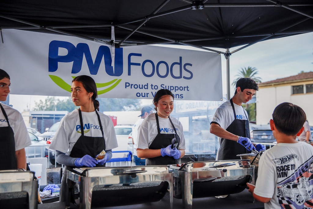 (sponsored, PMI Foods) | PMI Foods volunteers serve donated food at Los Angeles event for veterans and their families in collaboration with the Dream Center and CityServe.