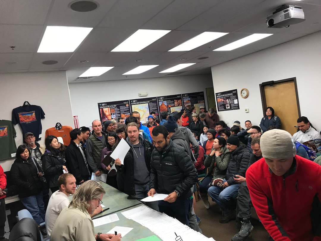 (Jennifer Kumar | Courtesy) Hopeful hikers crowd into the U.S. Bureau of Land Management's Kanab visitors center Dec. 28, 2017 to apply for a permit drawing to visit North Coyote Buttes, which includes The Wave rock formation, at the Utah-Arizona state line. The Wave is an iconic attraction in the Paria Canyon-Vermilion Cliffs Wilderness Area. Only 20 people per day may visit North Coyote Buttes; 10 permits are granted at the daily drawing in Kanab, and 10 are distributed in an online lottery.