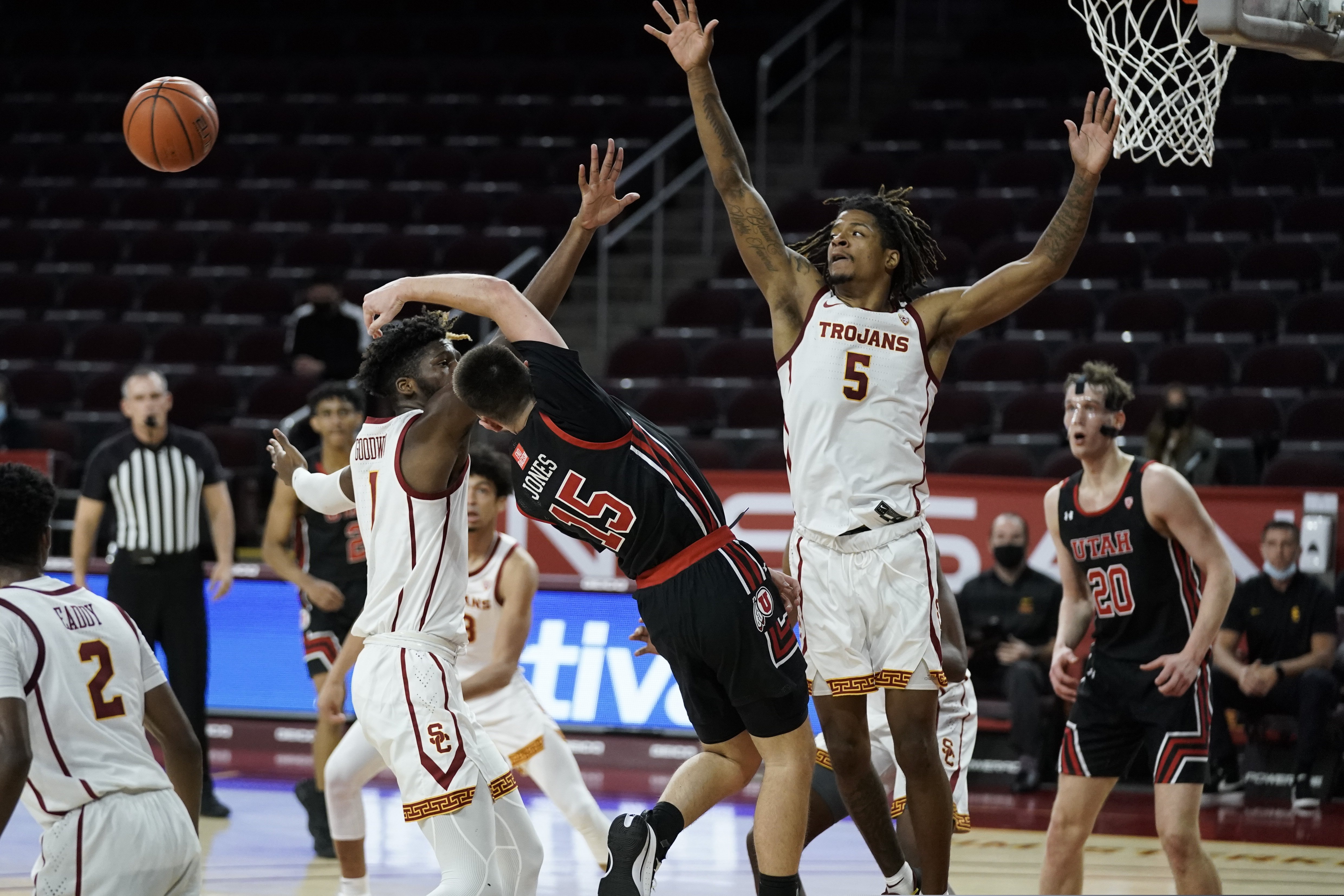 (Jae C. Hong | The Associated Press) Utah's Rylan Jones, center, passes the ball as he is defended by Southern California's Isaiah White, right, and Chevez Goodwin during the first half of an NCAA college basketball game, Saturday, Jan. 2, 2021, in Los Angeles.