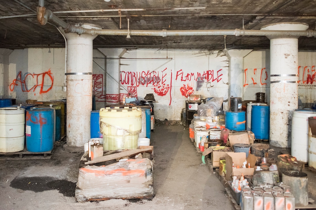 (Briana Scroggins  |  The Utah Investigative Journalism Project) Drums are organized by the properties of their contents in a lower level of the Swift building in Ogden on Thursday, May 16, 2019. On-scene Coordinator for the EPA Paul Peronard said that he expects the total number of containers to reach about 60,000. The EPA started site clean up on April 1 and plan to finish by August 2019.