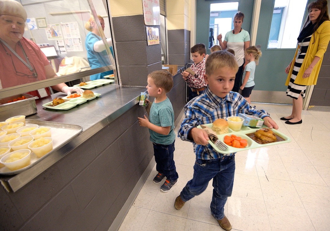 (Al Hartmann  |  The Salt Lake Tribune)  Students, staff and everyone else eats lunch together at Park Valley School. That day, the cafeteria served up beef, mashed potato and gravy, carrots, pears, milk and amazing hot rolls.