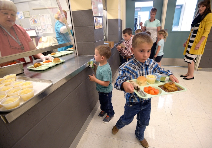 (Al Hartmann | The Salt Lake Tribune) Students, staff and everyone else eats lunch together at Park Valley School. That day, the cafeteria served up beef, mashed potato and gravy, carrots, pears, milk and amazing hot rolls.