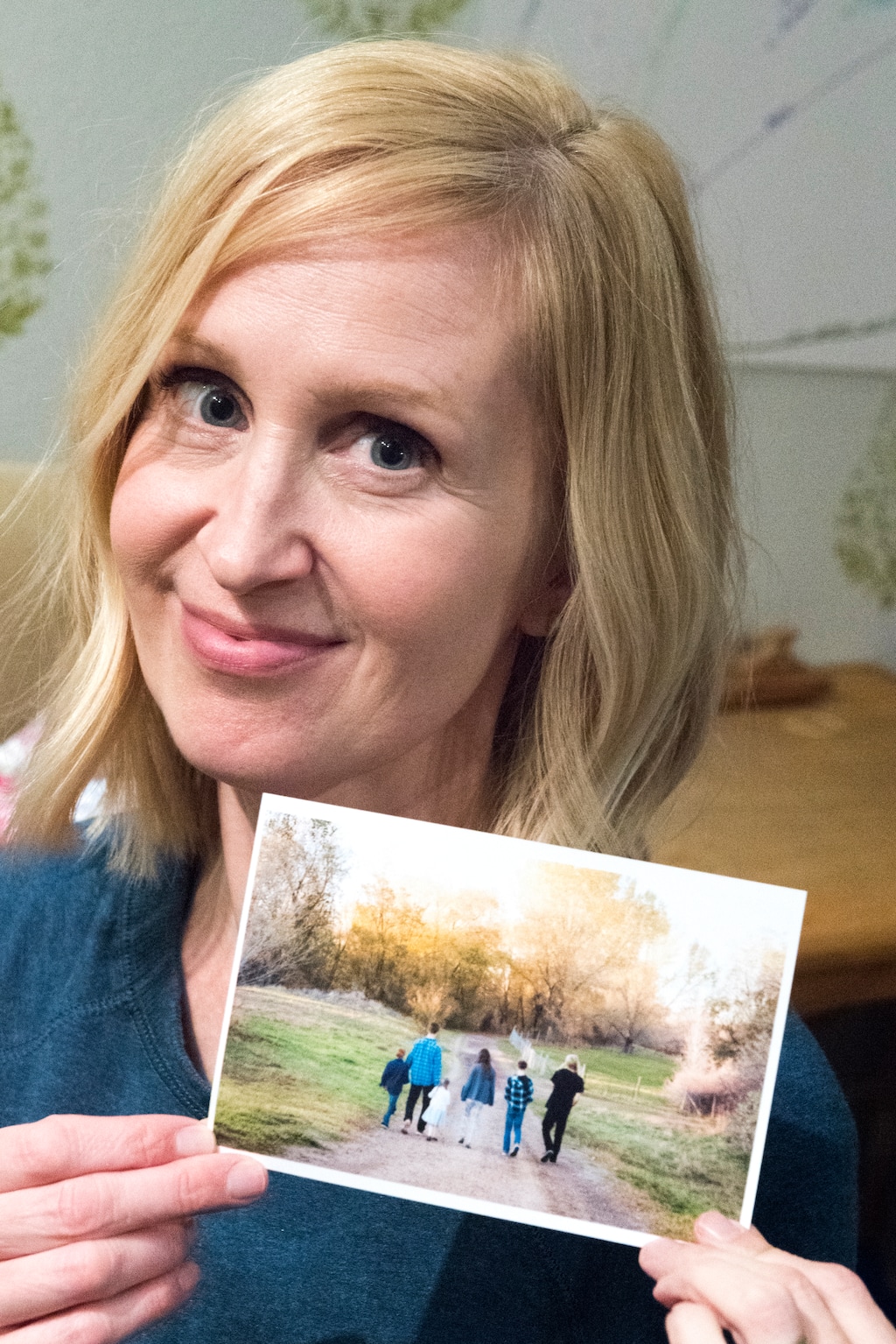 (Rick Egan  |  The Salt Lake Tribune)   Angela Ashurst-McGee  with a photo of her six children, writes about her complicated mix of feelings in "Two Feelings at Once."  Thursday, December 7, 2017.