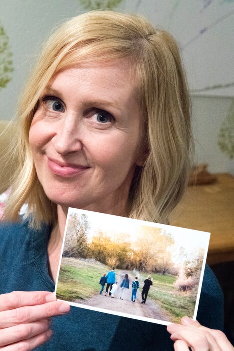 (Rick Egan  |  The Salt Lake Tribune)   Angela Ashurst-McGee  with a photo of her six children, writes about her complicated mix of feelings in "Two Feelings at Once."  Thursday, December 7, 2017.