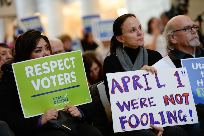 (Francisco Kjolseth  |  The Salt Lake Tribune)  Ma Black, Beth Armstrong and Bob Mayhew become emotional as they hear the words given by cancer survivor Christie Sorensen who says medicaid saved her life during a demonstration in the Capitol rotunda on Monday, Jan, 28, 2019, on the first day of the Legislative session to rally in support of protecting Proposition 3, the Medicaid Expansion law recently passed by voters.