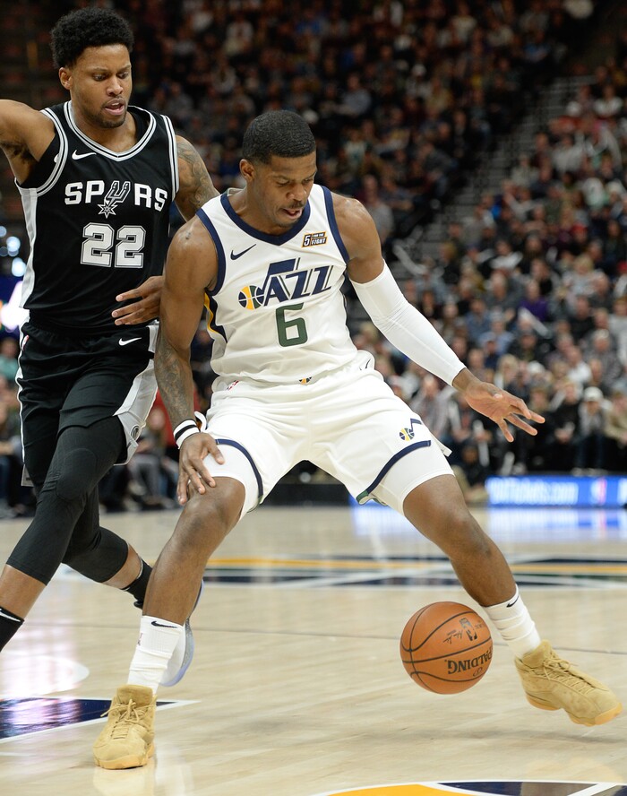 (Francisco Kjolseth  |  The Salt Lake Tribune)  San Antonio Spurs forward Rudy Gay (22) moves in on Utah Jazz guard Joe Johnson (6) during the first quarter of an NBA basketball game in Salt Lake City, Thursday, Dec. 21, 2017.