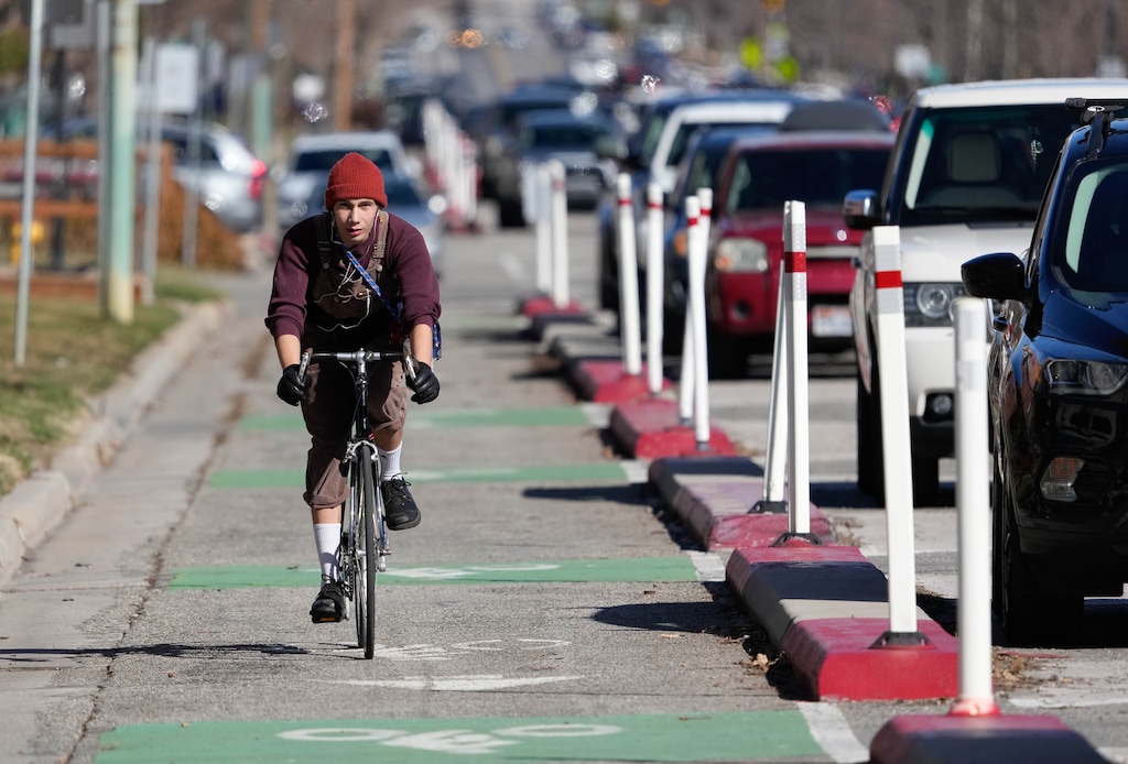 (Francisco Kjolseth | The Salt Lake Tribune) Cyclists use the designated bike lanes along 300 South in downtown Salt Lake City in March 2023. Salt Lake Tribune readers say they want to see more bike lanes in Utah's capital.