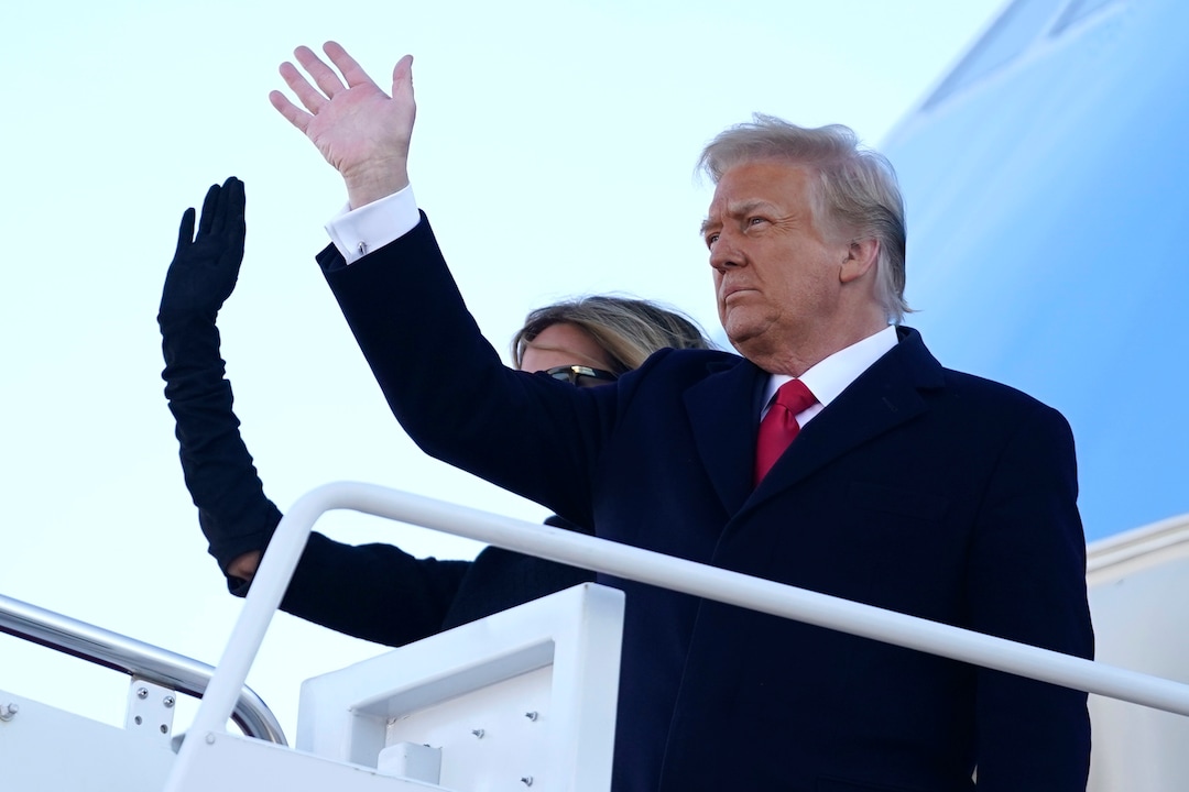President Donald Trump and first lady Melania Trump board Air Force One at Andrews Air Force Base, Md., Wednesday, Jan. 20, 2021.(AP Photo/Manuel Balce Ceneta)