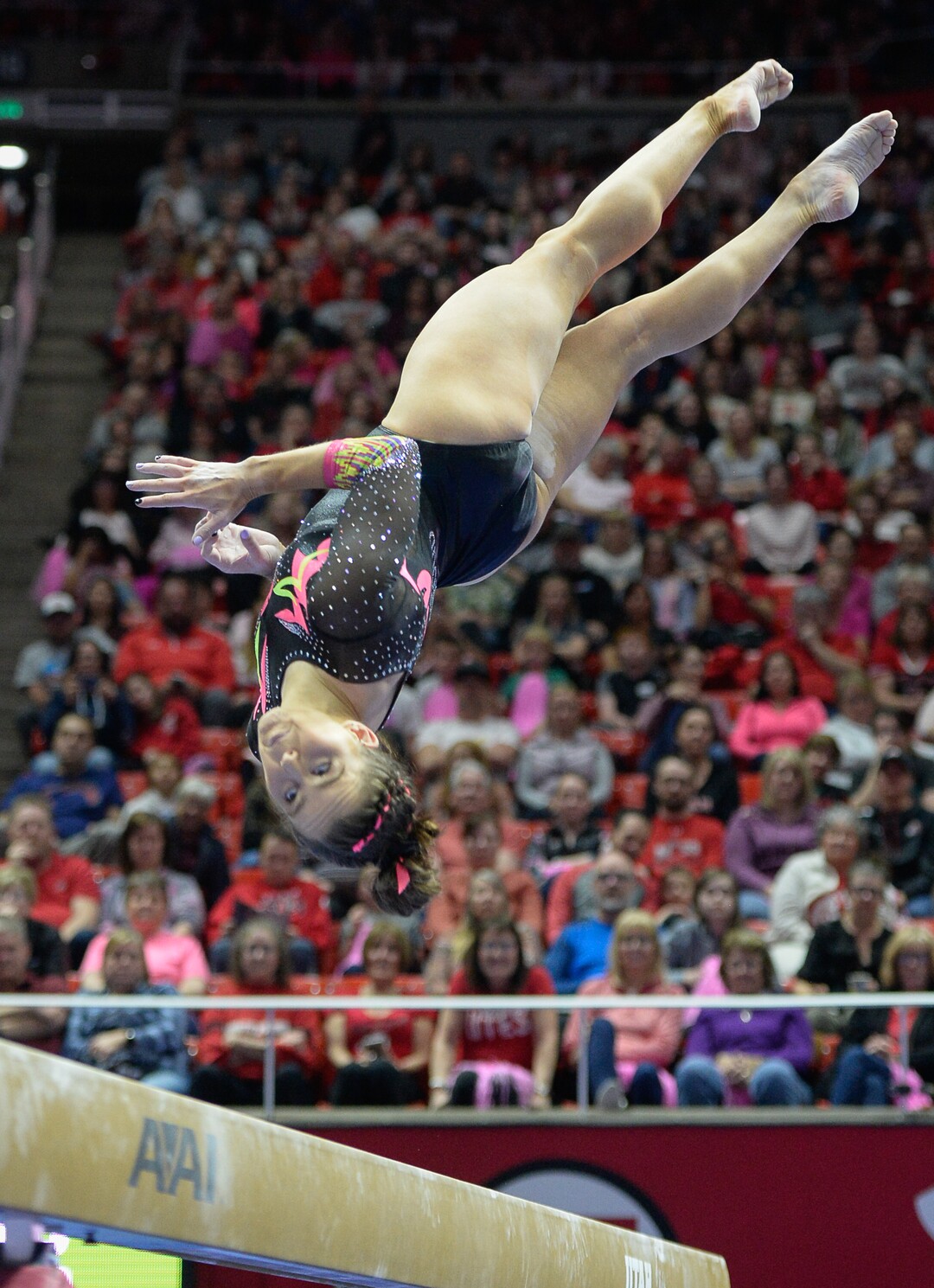 (Francisco Kjolseth  |  The Salt Lake Tribune) Adrienne Randall performs her signature move called the Rulfova, a full twisting swing down to cross saddle sit, as the fourth-ranked University of Utah Red Rocks gymnastics team host Stanford, Friday, March 6, 2020, at the Jon M. Huntsman Center in Salt Lake City.