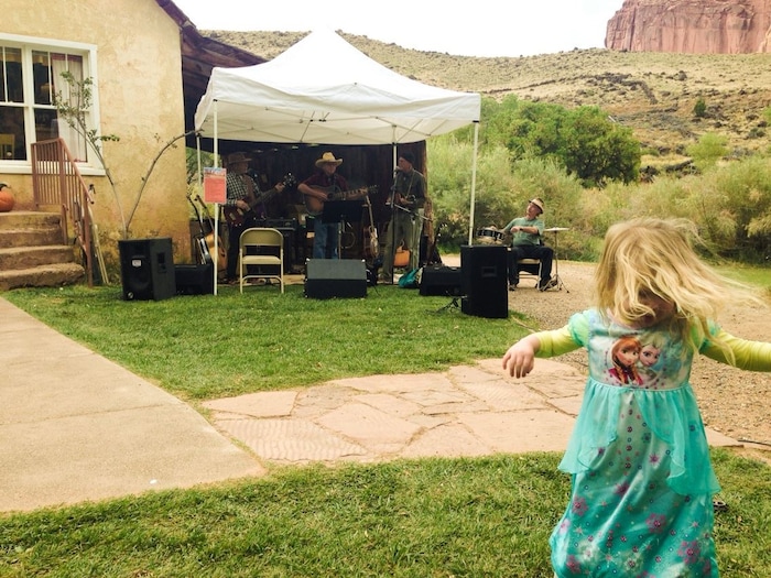 Erin Alberty  |  The Salt Lake TribuneThe author's daughter, Saskia, rocks out to a band called the Capitol Reefers during the Harvest Festival on Oct. 4, 2015 at Capitol Reef National Park.