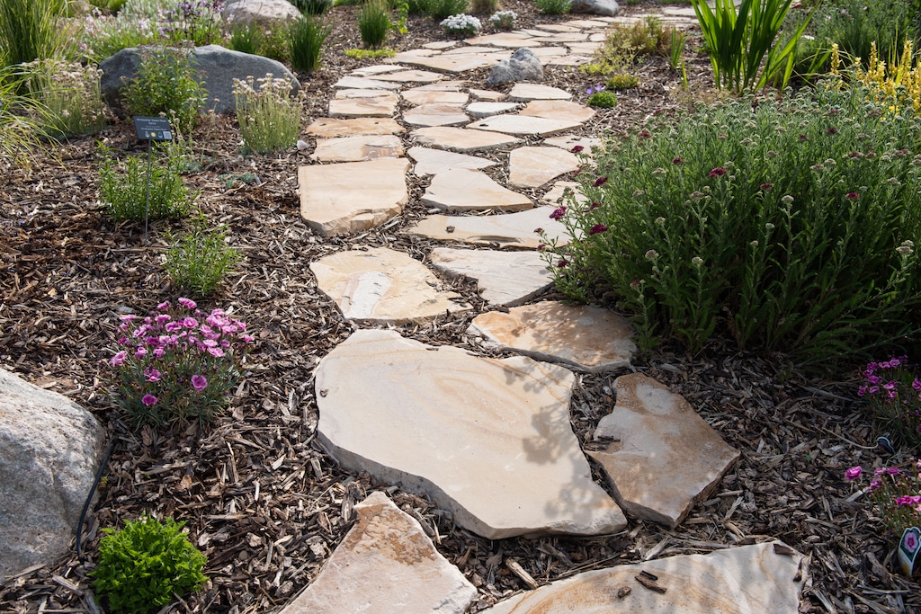 (Briana Scroggins | Special to The Tribune) Weber Basin’s Water Conservation Learning Garden has hundreds of ideas for xeriscaping or reducing water usage for lawns and gardens. A variety of plants, flowers and trees that require less water as well as rocks, mulch and structures for landscaping can be found at the Learning Garden in Layton on Saturday, June 12, 2021.
