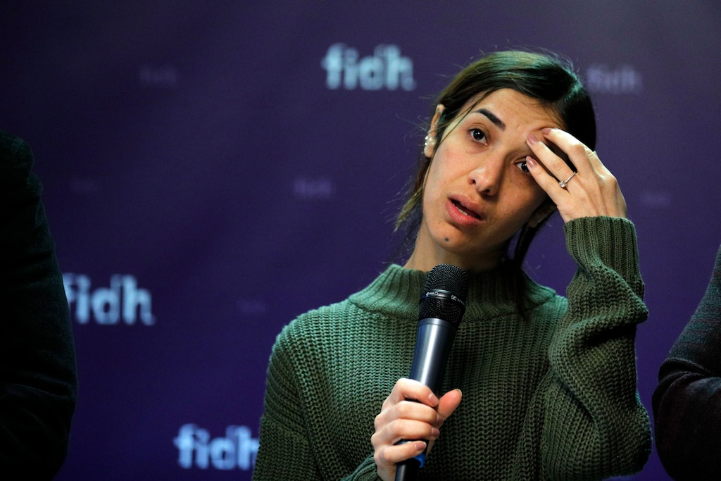 Nadia Murad, a Yazidi who escaped the Islamic State and a co-recipient of this year's Nobel Peace Prize, reacts while speaking at a news conference at the International Federation for Human Rights office in Paris, Thursday, Oct. 25, 2018. An international human rights group says foreign fighters, including many Europeans, were responsible for carrying out the Islamic State group's atrocities against minority Yazidis. (AP Photo/Francois Mori)