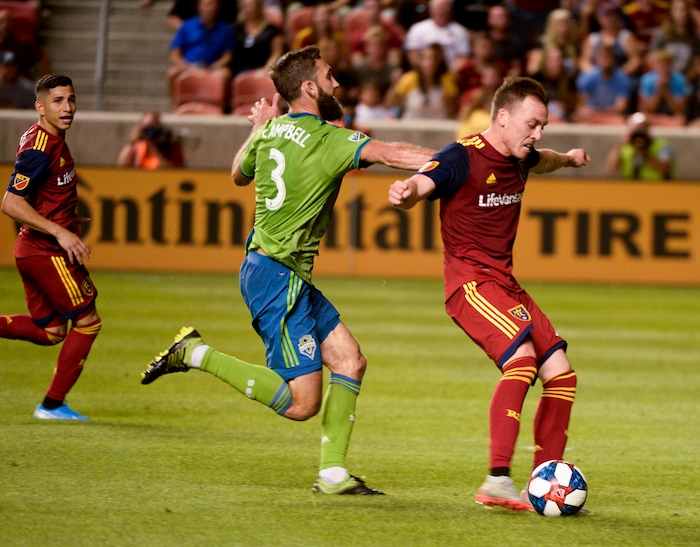 (Leah Hogsten  |  The Salt Lake Tribune) Seattle Sounders defender Jonathan Campbell (3) canÕt get to Real Salt Lake forward Corey Baird (17) who kicks in the third goal as Real Salt Lake hosts the Seattle Sounders, Aug. 14, 2019, at Rio Tinto Stadium in Sandy. RSL defeated the Sounders 3-0.