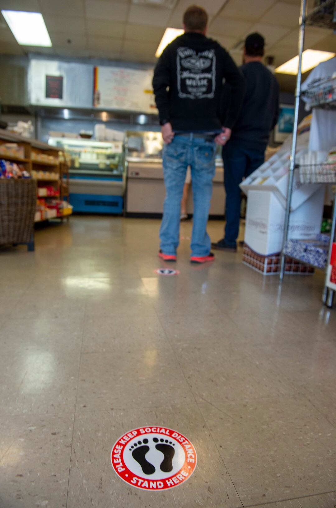 (Rick Egan  |  The Salt Lake Tribune)    Diners keep their distance as they wait to order food at Siegfried's Delicatessen,Friday May 1, 2020