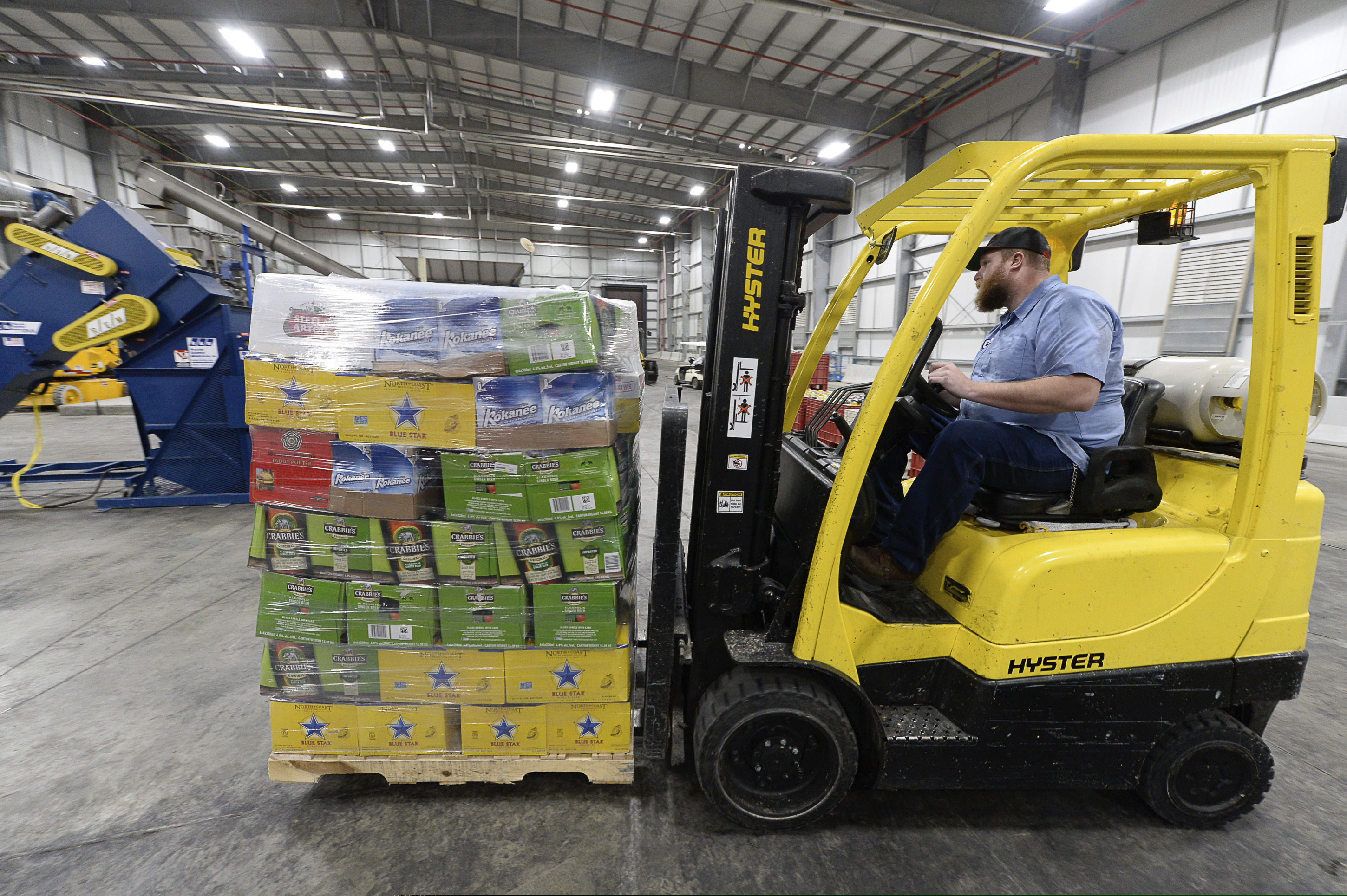 Operator Braeden Adamson maneuvers a forklift as the DABC in North Salt Lake on Friday, Dec. 13, 2019.