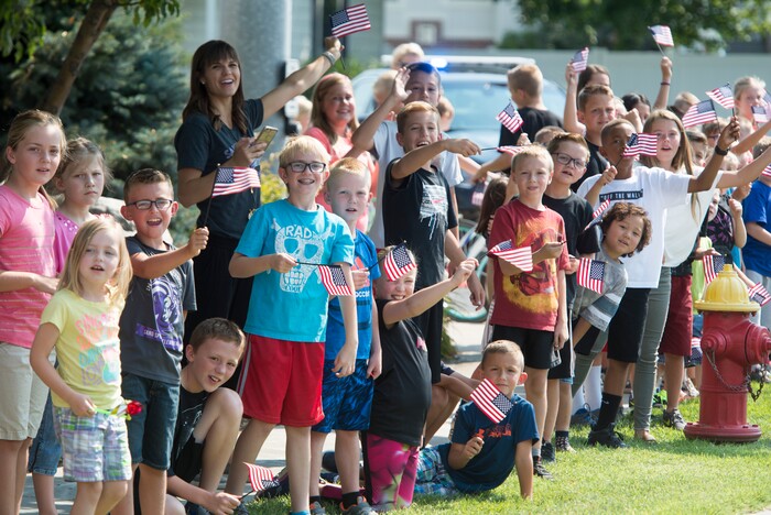 (Rick Egan  |  The Salt Lake Tribune)  Kids cheer on the racers on Gentile Street in Layton, in the Tour of Utah stage 5, Friday, August 4, 2017.


