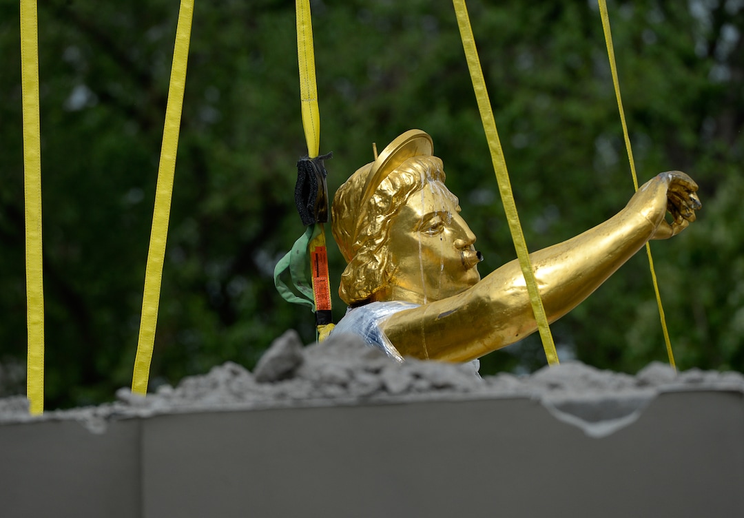 (Francisco Kjolseth  |  The Salt Lake Tribune) Crews work to remove the Angel Moroni statue atop the Salt Lake Temple of The Church of Jesus Christ of Latter-day Saints on Monday, May 18, 2020. The temple closed in December for seismic upgrades and sustained minor damager during the March 18, 2020, magnitude 5.7 earthquake when the trumpet held by the angel fell off and several smaller spire stones were displaced.