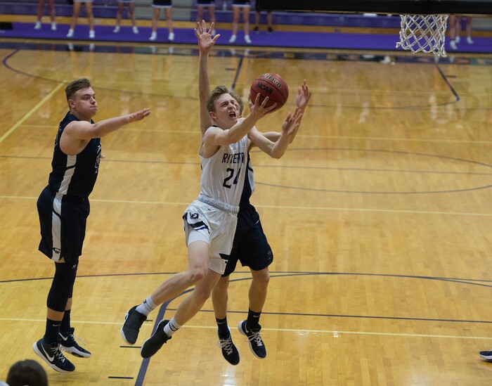 Scott Sommerdorf | The Salt Lake TribuneRiverton's Richie Saunders slices in for a first half shot. Copper Hills defeated Riverton 54-50, Friday, February, 2, 2018. 