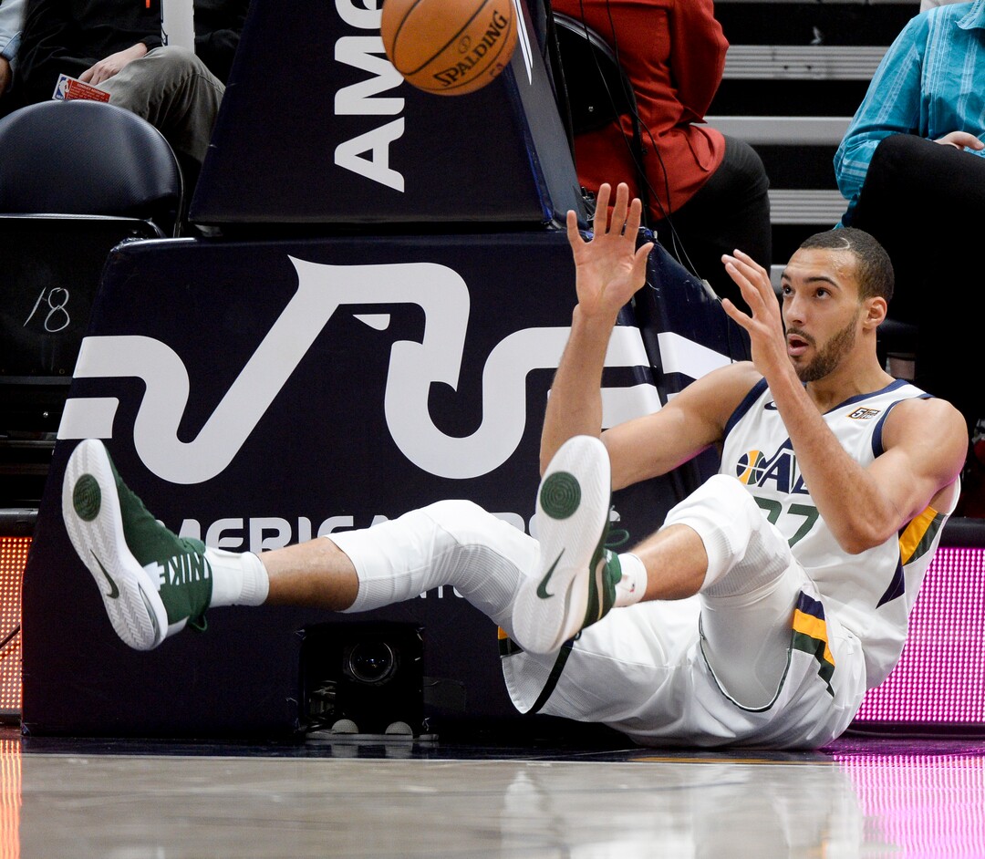 Leah Hogsten  |  The Salt Lake Tribune  Utah Jazz center Rudy Gobert (27) hits the deck after a defensive play in the first half as the Utah Jazz take on the Atlanta Hawks, Feb. 1, 2019 at Vivint Smart Home Arena. 