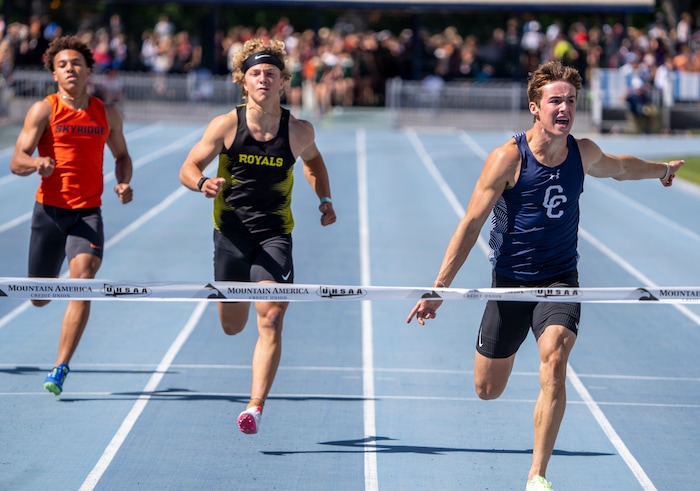 (Rick Egan | The Salt Lake Tribune)  Smith Snowden, from Skyridge and Parker Kingston, from Roy, trail Cody Hagen from Corner Canyon, as hagen wins the  6A Boys 200 meter dash, at the State High School Championships at BYU, on Saturday, May 21, 2022.
