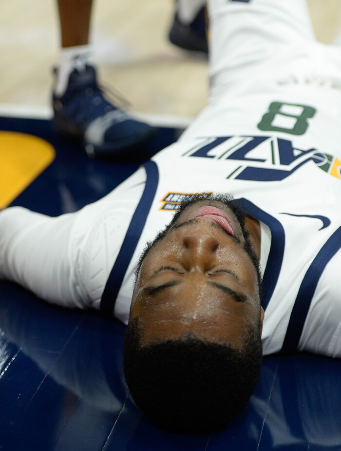 (Francisco Kjolseth  |  The Salt Lake Tribune)  Utah Jazz guard Emmanuel Mudiay (8) takes a moment after getting knocked down to the floor as the Utah Jazz host the Portland Trailblazers in their NBA basketball game at Vivint Smart Home Arena in Salt Lake City on Wed. Oct. 16, 2019.