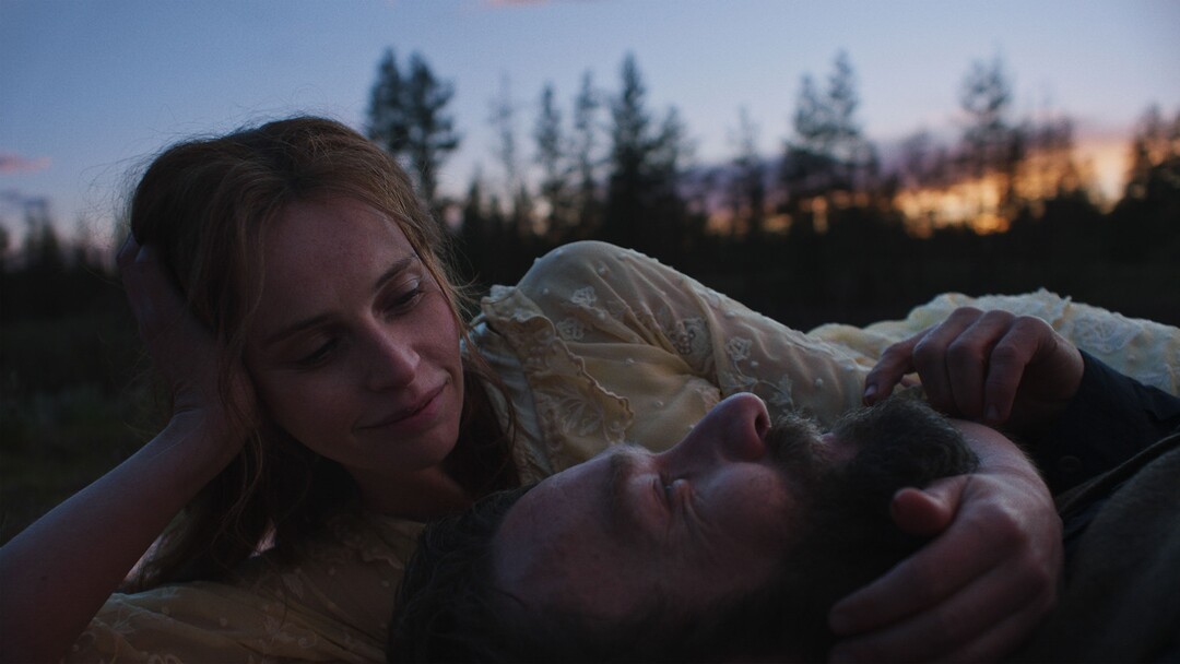 (Adolpho Veloso  |  Netflix) Joel Edgerton, bottom, and Felicity Jones star in director Clint Bentley's drama "Train Dreams."