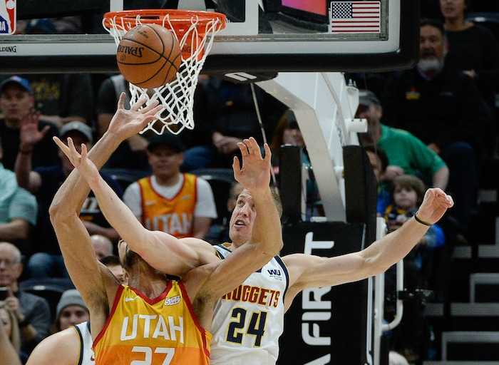(Francisco Kjolseth  |  The Salt Lake Tribune)  Utah Jazz center Rudy Gobert (27) battles Denver Nuggets forward Mason Plumlee (24) for a rebound as the Utah Jazz host the Denver Nuggets in their NBA game at Vivint Smart Home Arena Tuesday, April 9, 2019, in Salt Lake City.