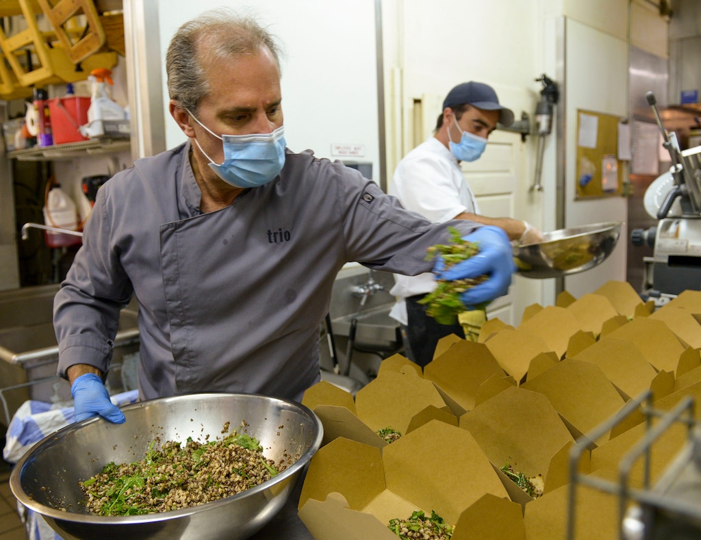 (Leah Hogsten  |  The Salt Lake Tribune) Trio restaurant owner Mikel Trapp and executive chef Lloyd Kianfar prepare summer grain salads to feed front-line workers June 3, 2020. Since March, the Helping Heroes program, launched by Utah restaurant food supplier Nicholas & Co., has been taking food originally planned for restaurants and using it to feed front-line COVID-19 workers across the Wasatch Front.