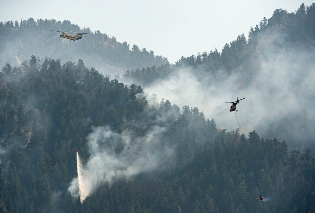 (Francisco Kjolseth  |  The Salt Lake Tribune) Air and ground crews continue to fight the slow-moving fire near Neffs Canyon in the Mount Olympus Wilderness on Friday, Sept. 25, 2020. Olympus Cove neighbors have been urged to be ready to evacuate should the fire move closer to homes.