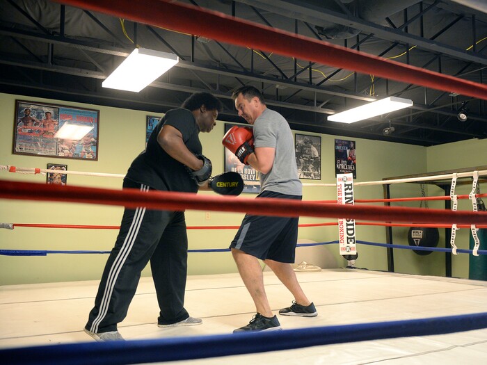 (Al Hartmann | The Salt Lake Tribune)
House Speaker Greg Hughes spars with Eddie "Flash" Newman during his workout at the Flash Academy gym in Holladay Tuesday August 29. He's among a handful of local politicians, police and lobbyists who will box in a series of charity matches to benefit a national group that works to end domestic violence.