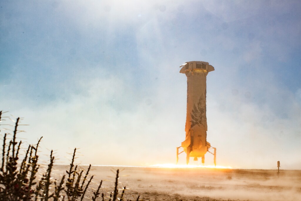 (Blue Origin via AP) In this photo provided by Blue Origin, the New Shepard booster lands in west Texas during a test on Tuesday, Dec. 12, 2017. Named after the first American in space, Alan Shepard, the spacecraft made a 10-minute suborbital flight.