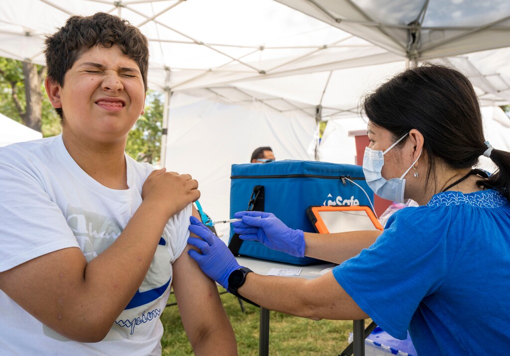(Rick Egan | The Salt Lake Tribune) Nurse Jen Phung administers a COVID-19 vaccination to Darey Miranda, 12, at the Friendly Islands Tongan Festival, at Jordan Park, on Friday, Aug. 13, 2021.