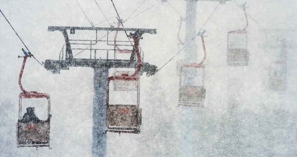 (Steve Griffin | The Salt Lake Tribune) This March 14, 2016, file photo, shows heavy snow blanketing skiers as they ride the gondola from the parking lot to the base of the mountain at Canyons Village ski area in Park City, Utah. Utah resorts still want skiers and snowboarders to come enjoy their groomed slopes and high speed lifts this season, but they're also offering expanded options for people who want to get a taste of the backcountry without the risk of going alone.
