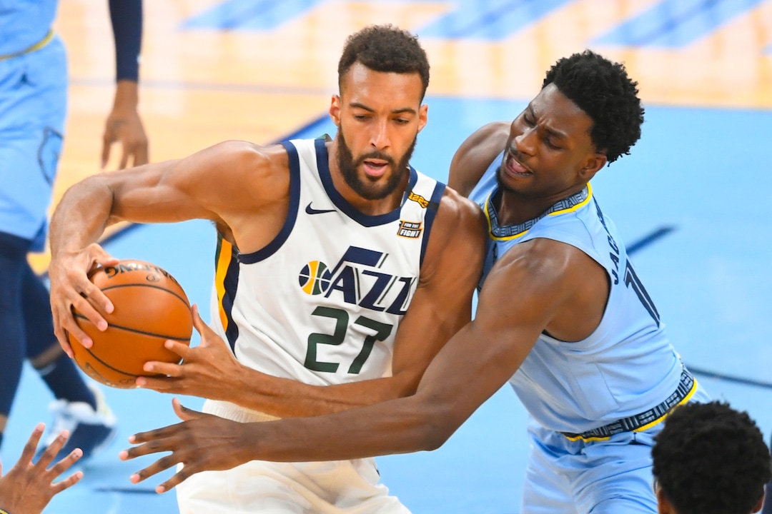 Utah Jazz center Rudy Gobert (27) tries to keep the ball from Memphis Grizzlies forward Jaren Jackson Jr. during the first half of Game 3 of an NBA basketball first-round playoff series Saturday, May 29, 2021, in Memphis, Tenn. (AP Photo/John Amis)