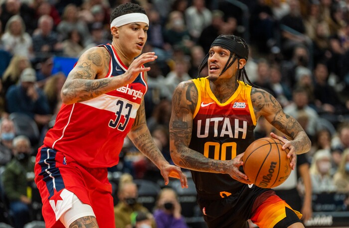 (Rick Egan | The Salt Lake Tribune) Utah Jazz guard Jordan Clarkson (00)] takes the ball inside as Washington Wizards forward Kyle Kuzma (33) defends, in NBA action between the Utah Jazz and the Washington Wizards, at Vivint Arena on Saturday, Dec. 18, 2021.