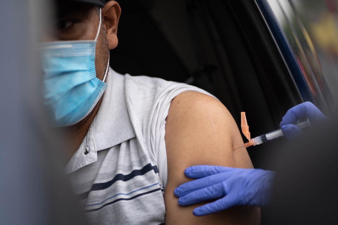 (Francisco Kjolseth | The Salt Lake Tribune) Carlos Salazar receives his first dose of the Moderna vaccine as the Salt Lake County Health Department in collaboration with Clinica de Salud EZ offers a COVID-19 vaccination clinic to the Hispanic community at 339 East 3900 South in Salt Lake City, on Saturday, April 24, 2021.