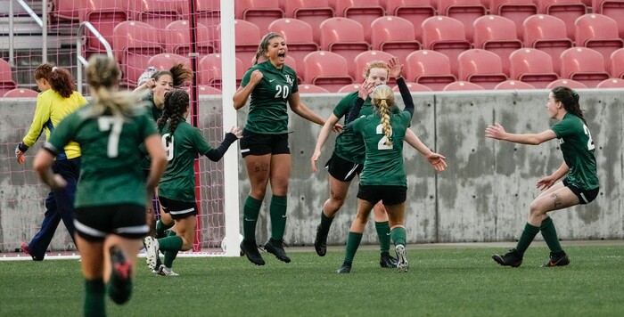 (Leah Hogsten | The Salt Lake Tribune)  RHSM's Paige Connery (2) celebrates Mary Bocock's (17) goal in the second half. Waterford School defeated Rowland Hall-St. Marks High School, 4-3 to win the 2A State Soccer Championship game Oct. 23, 2021 at Rio Tinto Stadium.