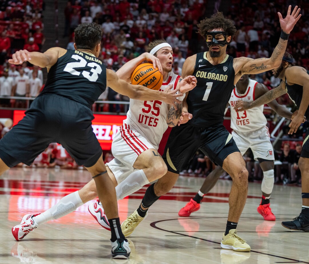 (Rick Egan | The Salt Lake Tribune) Utah Utes guard Gabe Madsen (55) takes the ball to the hoop, as Colorado Buffaloes forward Tristan da Silva (23) and Buffaloe guard J'Vonne Hadley (1) defend, in PAC-12 basketball action between the Utah Utes and the Colorado Buffaloes a the Jon M. Huntsman Center, on Saturday, Feb. 3, 2024.