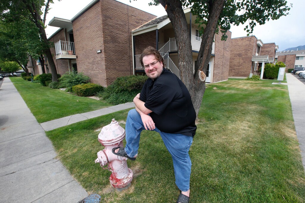 Christian Haskins, 37, is shown at his home Thursday, July 23, 2020, in Millcreek, Utah. Federal unemployment aid that has helped avert financial ruin for millions of Americans is expiring in Utah and elsewhere on Saturday, July 25, 2020, leaving many residents unsure of how they'll pay their bills as the number of new COVID-19 cases continue to rise. He was laid off from his job as a labor coordinator for live events in July. Without the $600-a-week federal enhancement to his unemployment, he'll be barely scraping by and he's scared of what could happen if he has a costly emergency. (AP Photo/Rick Bowmer)