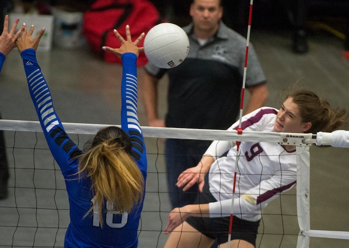 (Rick Egan  |  The Salt Lake Tribune)    Lone Peak Knights  Madelyn Robinson (9) hits the ball as Pleasant Grove Vikings Megan Sintay (18) defends, in the 6A volleyball championship action, Pleasant Grove vs. Lone Peak, at Utah Valley University, Saturday, November 4, 2017.