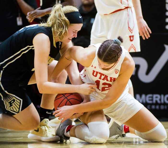 (Rick Egan  |  The Salt Lake Tribune)  Utah Utes forward Emily Potter (12) goes for the ball along with Purdue Boilermakers center Nora Kiesler (12), in basketball action Utah Utes vs. Purdue Boilermakers, at the Jon M. Huntsman Center, Monday, November 20, 2017.