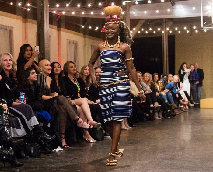 (Rick Egan  |  The Salt Lake Tribune)  Diane Sawadogo from Burkina Faso, walks the runway, at the 8th Annual Women of the World Fashion Show. The fashion show fund is raiser for the non-profit that seeks to help refugees settle in a new culture. Wednesday, March 7, 2018.