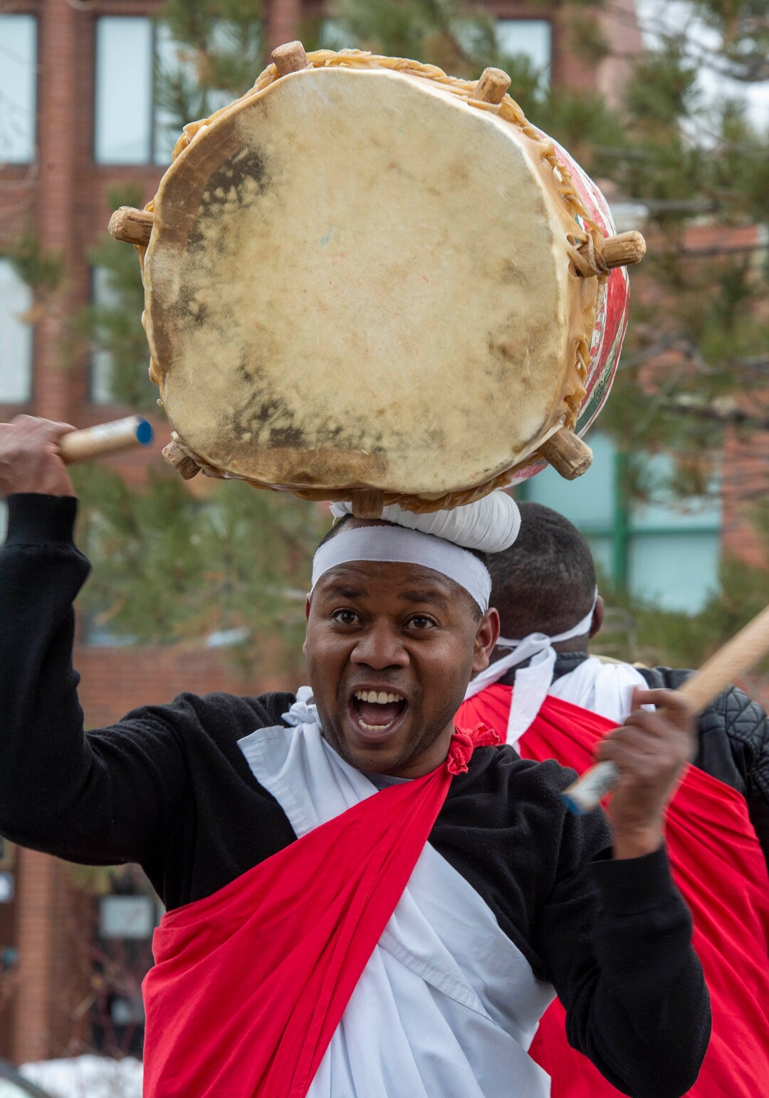(Rick Egan  |  The Salt Lake Tribune)     The Alex Ngendakuriyo performs with the Jambo Africa Burundi Drummers, at the Sundance bonfire community gathering on Swede Alley, in Park City, Thursday, Jan. 30, 2020.