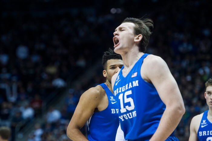 (Rick Egan  |  The Salt Lake Tribune)  Brigham Young Cougars forward Yoeli Childs (23) reacts as he helps Brigham Young Cougars forward Payton Dastrup (15) to his feat after he drew an offensive foul, in basketball action Utah Utes vs. Brigham Young Cougars at the Marriott Center in Provo, Saturday, December 15, 2017.


