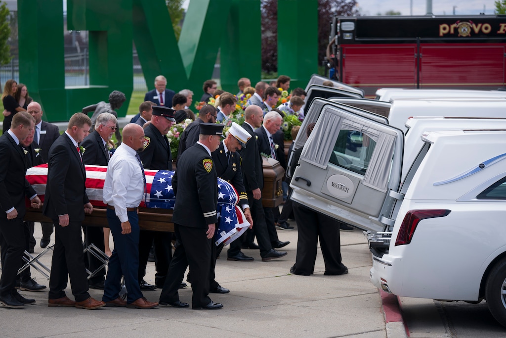 (Bethany Baker | The Salt Lake Tribune) Pallbearers load the caskets of Provo Fire Capt. Spencer Long, his wife Katrina, and their sons, Reid, Thayne and Gage, following a public memorial ceremony for them at Utah Valley University in Orem on Wednesday, July 29, 2026. The family died after a flash flood hit the area where they were camping and canyoneering.