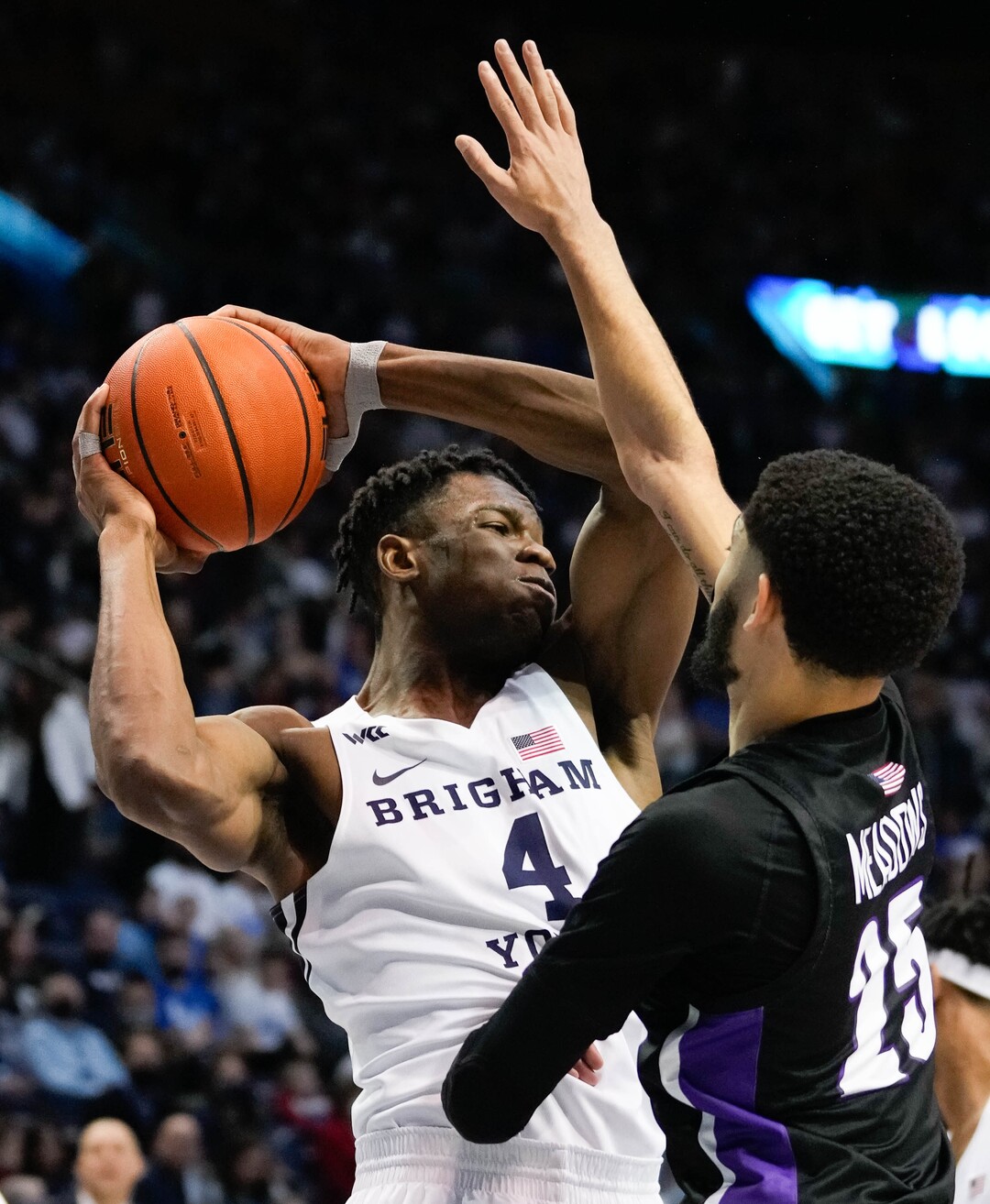 (Francisco Kjolseth | The Salt Lake Tribune) Brigham Young Cougars forward Atiki Ally Atiki (4) pulls down a rebound over Portland Pilots guard Mike Meadows (25) in WCC basketball action between the Brigham Young Cougars and the Portland Pilots, at the Marriott Center, on Saturday, January 22, 2022.