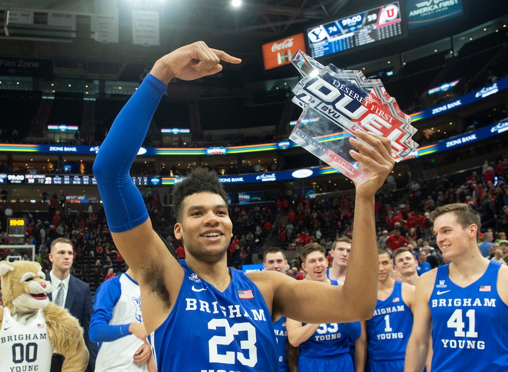 (Rick Egan  |  The Salt Lake Tribune)   Brigham Young forward Yoeli Childs (23) celebrates with the Deseret First Duel Trophy in basketball action in the Beehive Classic, between against the Brigham Young Cougars and Utah Utes, a the Vivint Smart Home Arena, Saturday December 8, 2018.