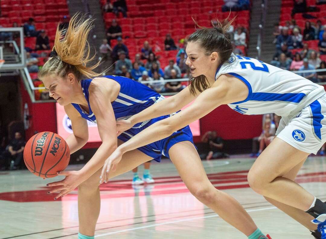 (Rick Egan  |  The Salt Lake Tribune)   Fremont Sliverwolves Averee Porter (23)  goes for a loose ball along with Bingham Miners Sierra Lichtie (20) in the 6A championship game, between the Fremont Sliverwolves and the Bingham Miners, at the Jon M. Huntsman Center, Saturday Feb. 29, 2020