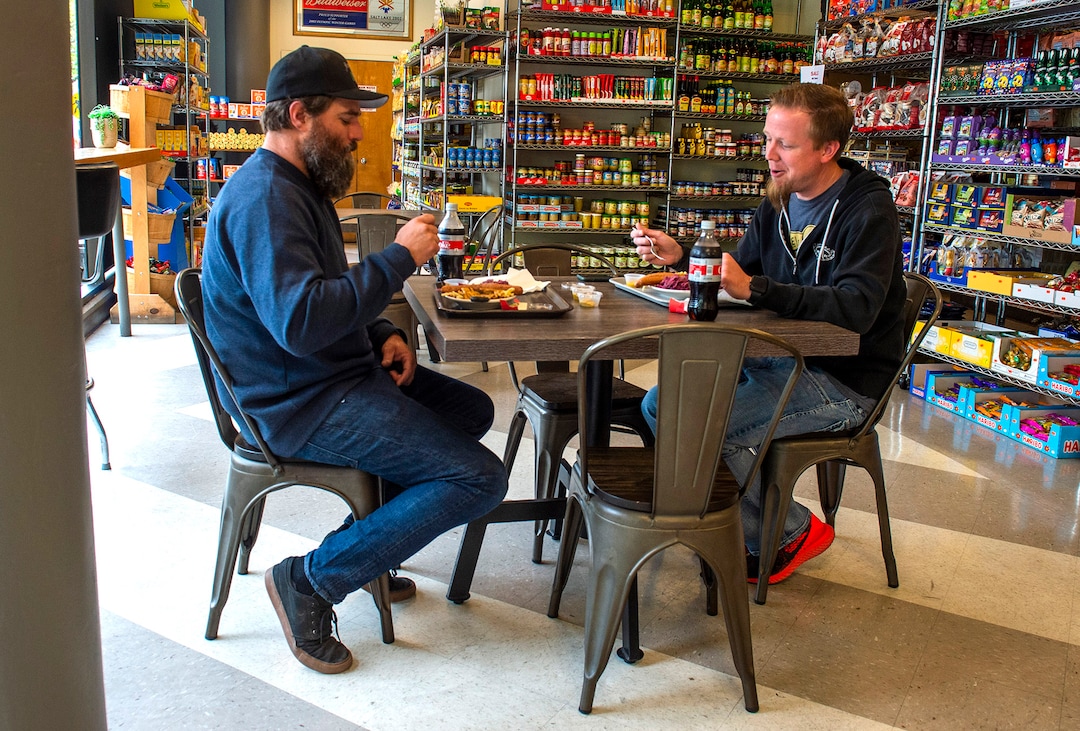 (Rick Egan  |  The Salt Lake Tribune)    Zac Flannery Rob Barber eat their lunch inside Siegfried's Delicatessen, which just opened up for indoor dining, Friday May 1, 2020