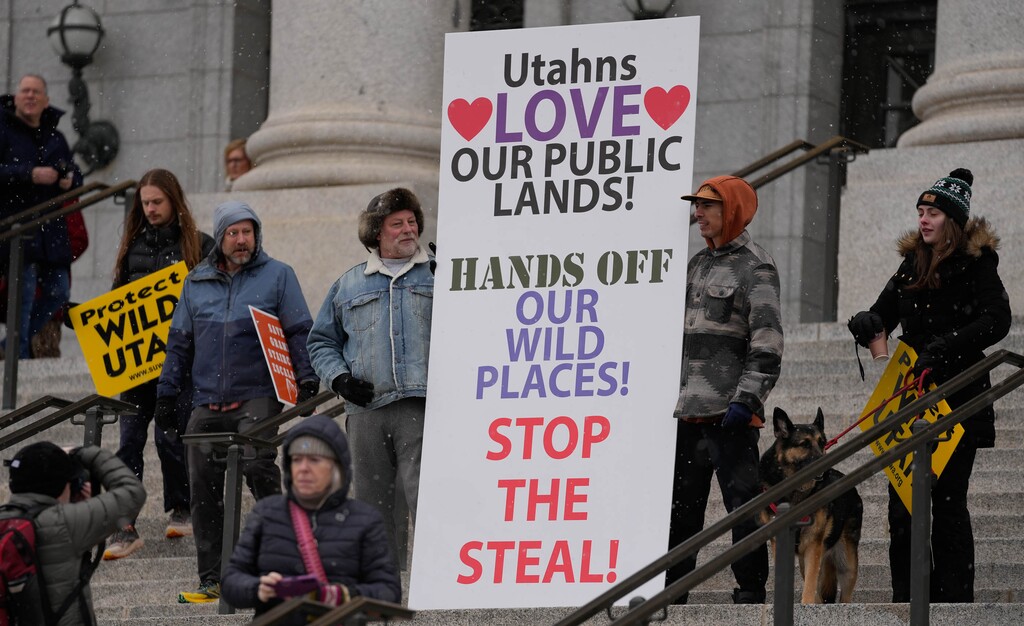 (Francisco Kjolseth  | The Salt Lake Tribune) People gather on the steps of the Utah Capitol during a rally, organized by Southern Utah Wilderness Alliance, in support of protecting public lands on Saturday, Jan. 11, 2025.  